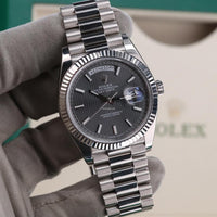 Rolex Day-Date 40 Presidential 228239 Fluted Bezel Dark Rhodium Stripe Motif Dial