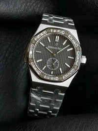 Audemars Piguet Royal Oak with a diamond-set bezel and small seconds sub-dial.