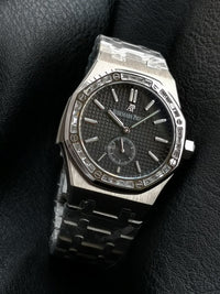 Audemars Piguet Royal Oak with a diamond-set bezel and small seconds sub-dial.