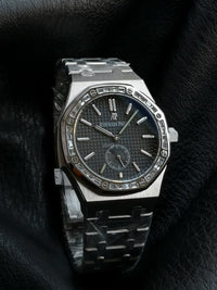 Audemars Piguet Royal Oak with a diamond-set bezel and small seconds sub-dial.