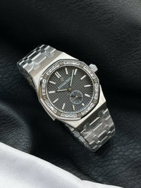 Audemars Piguet Royal Oak with a diamond-set bezel and small seconds sub-dial.