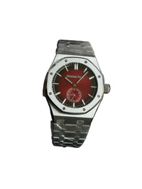 Audemars Piguet Royal Oak with a red dial and integrated bracelet.